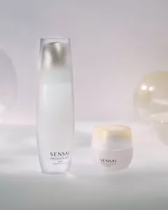 White moisturiser bottle and jar placed against a bright white background.​