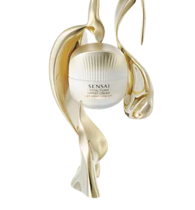 Total form expert cream surrounded by a golden emblem