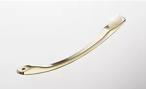 A small portion of white cream is scooped on a golden spatula